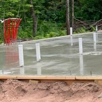 Concrete flatwork on job site with dirt work